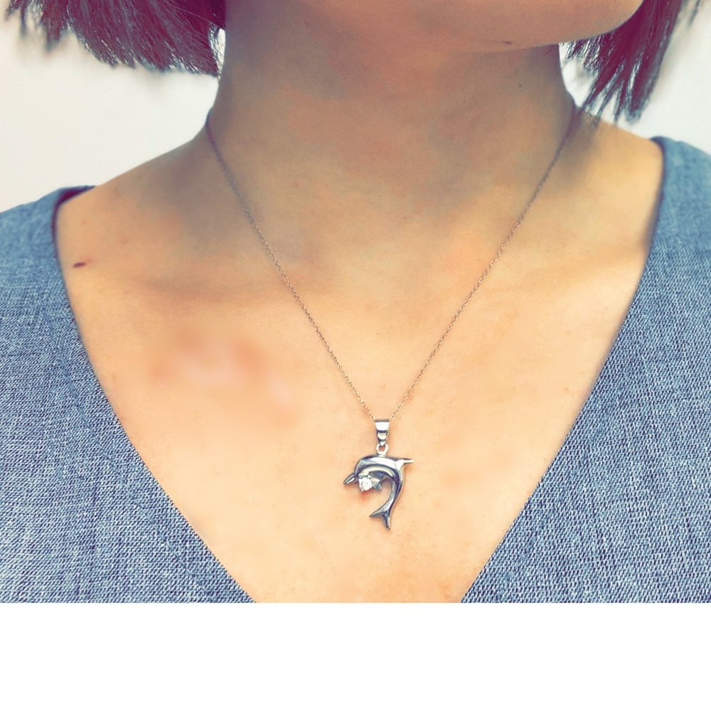 Dolphin Necklace with one diamond.